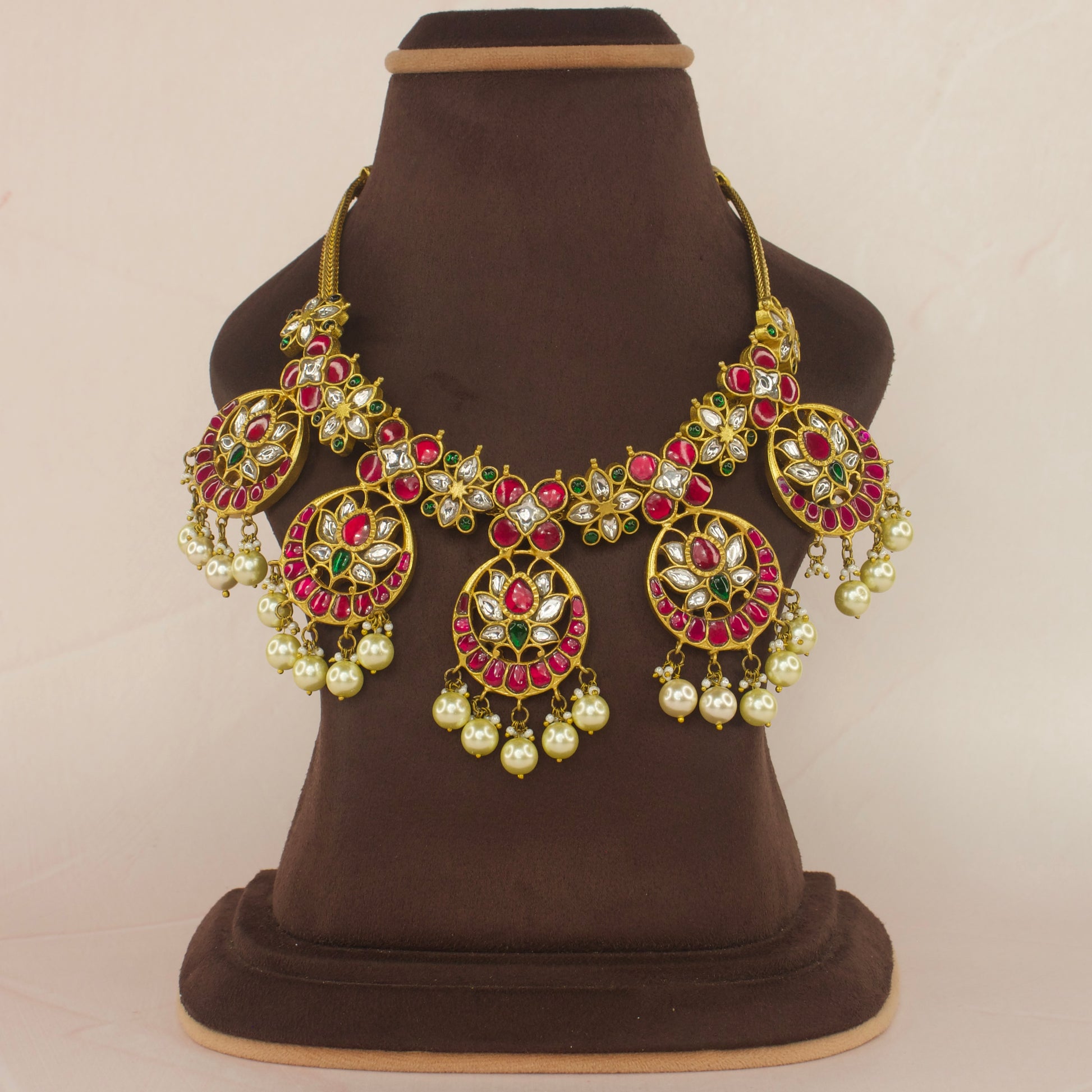 Regal Jadau Kundan Bottumala Necklace with Pearls and Floral Motifs with 22k gold platingThis product belongs to Jadau Kundan jewellery category