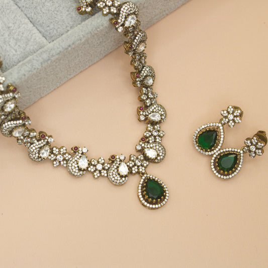 Simple Peacock Victorian Necklace Set with pearl drop earrings. This Victorian Jewellery is available in Red,Green & Purple colour variants. 