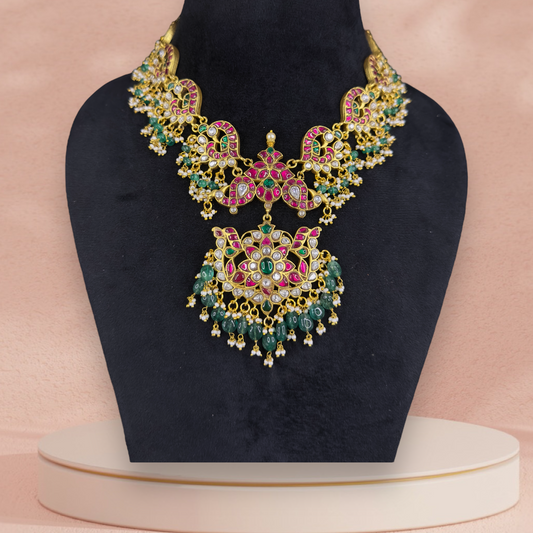 Regal Jadau Kundan Necklace with Enchanting Green Drops with 22k gold plating This product belongs to Jadau Kundan jewellery Category