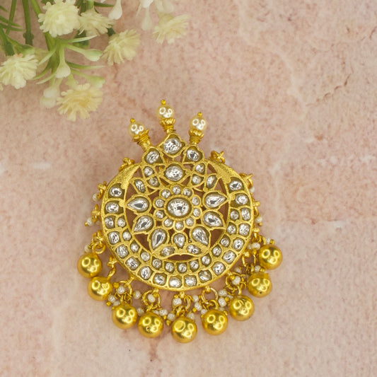 Elegant Jadau Kundan Pendant With White Kundan stones. This is covered in 22k gold plating and at the bottom of the pendant we have Gold balls and pearls