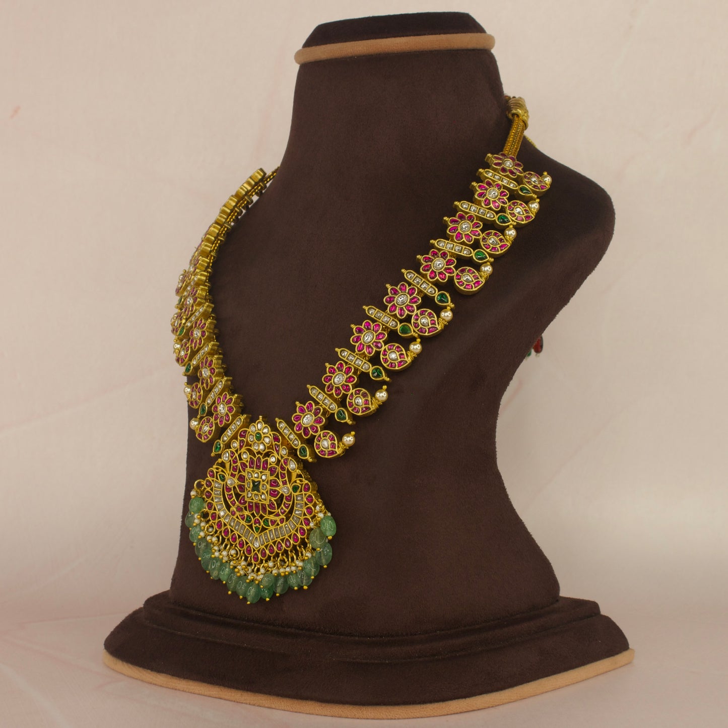 Grand Jadau Kundan Mango Necklace with Ruby and Emerald Adornmentswith 22k gold plating This product belongs to Jadau Kundan jewellery category 