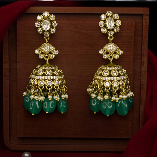 Victorian Diamond look Jhumka with onyx beads. This Victorian Jewellery Is available in Red & Green colour varaiants. 