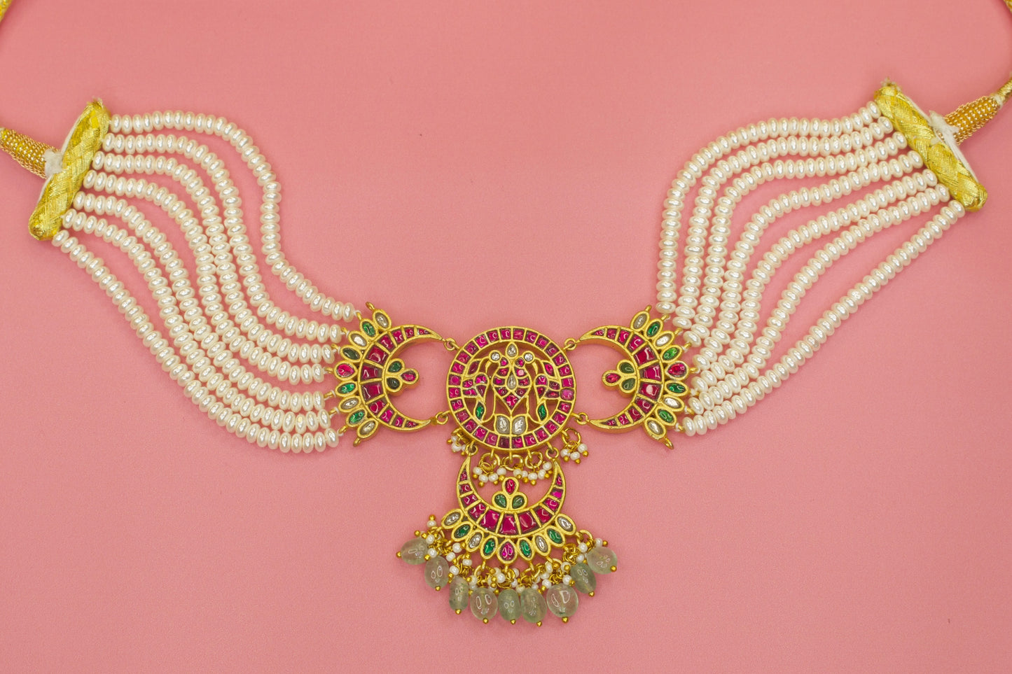 Heavenly Jadau setting Kundan Choker with uncut ruby and emerald gemstones, rice pearls, and beads! This traditional jewellery is apt for wedding and festive occasions!