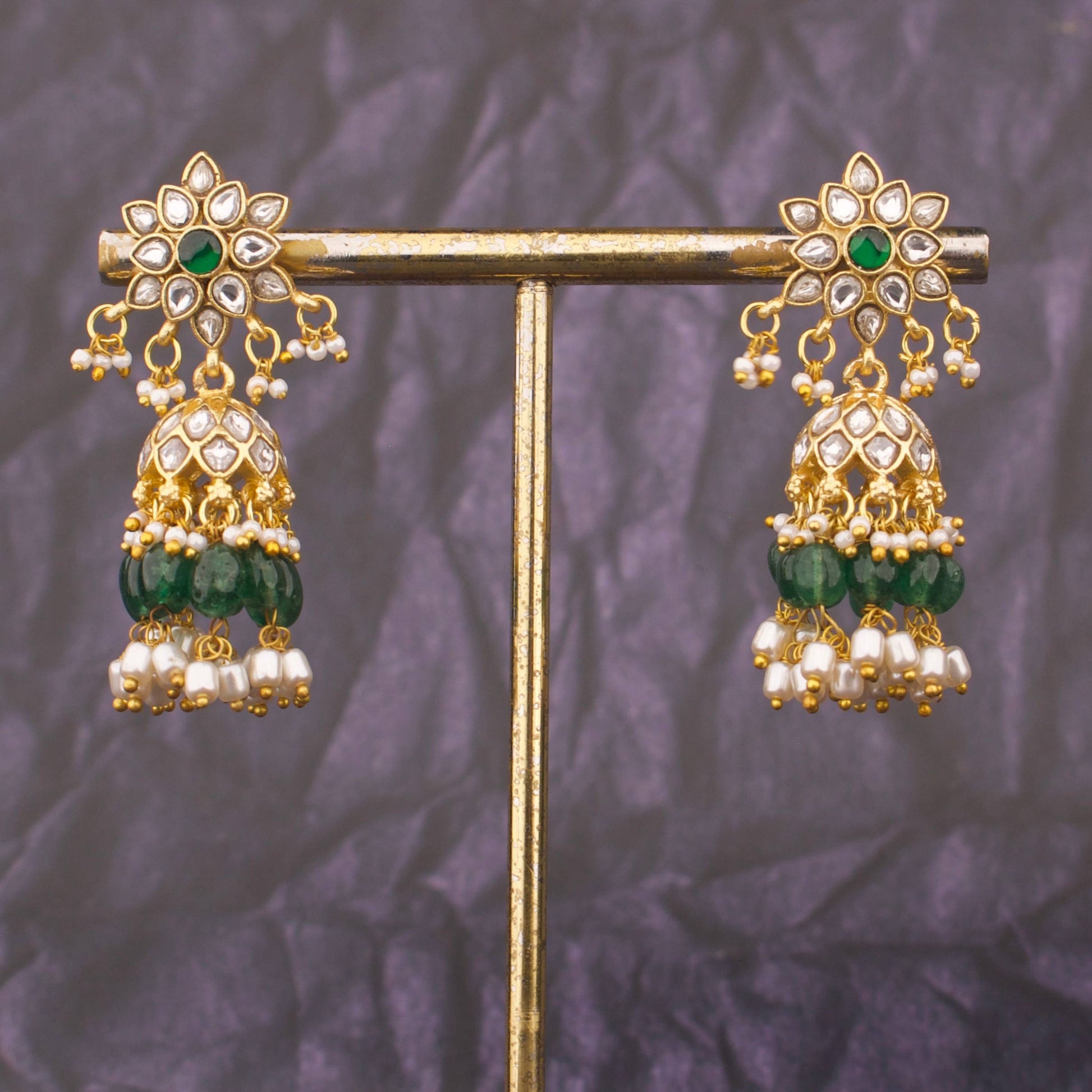 Close-up detailing of Floral Studded Jadau Kundan Jhumki With Pearl Hangings