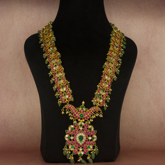 Exquisite Jadau Kundan Long Necklace with Russian Emeralds with 22k gold plating . This product belongs to Jadau Kundan jewellery collection