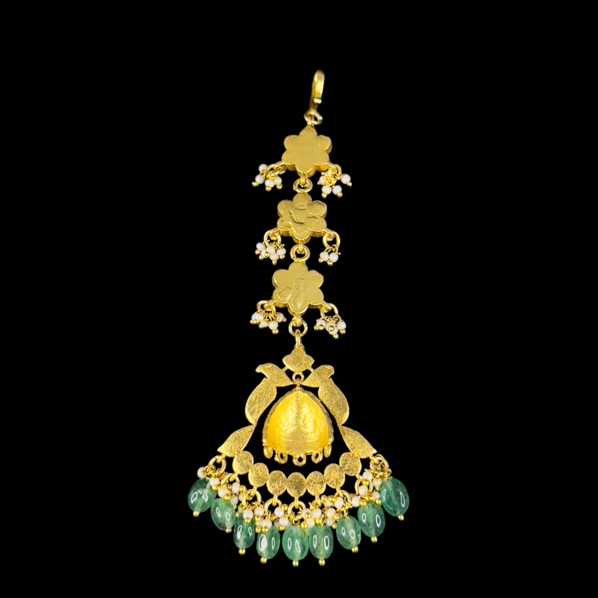 Floral Elegance Jadau Kundan Maang Tikka with Intricate Detailing and Emerald Drops with 22k gold plating This product belongs to Jadau Kundan jewellery category