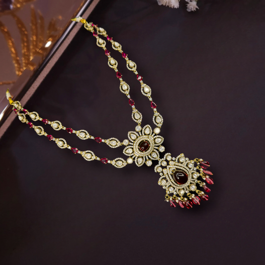 Traditional Two-Line Victorian Necklace with zircon, moissanite polki stones, peacock motif, pearls, and beads, including matching earrings. This Victorian Jewellery is available in pink, Red,Green & Purple colour variants. 