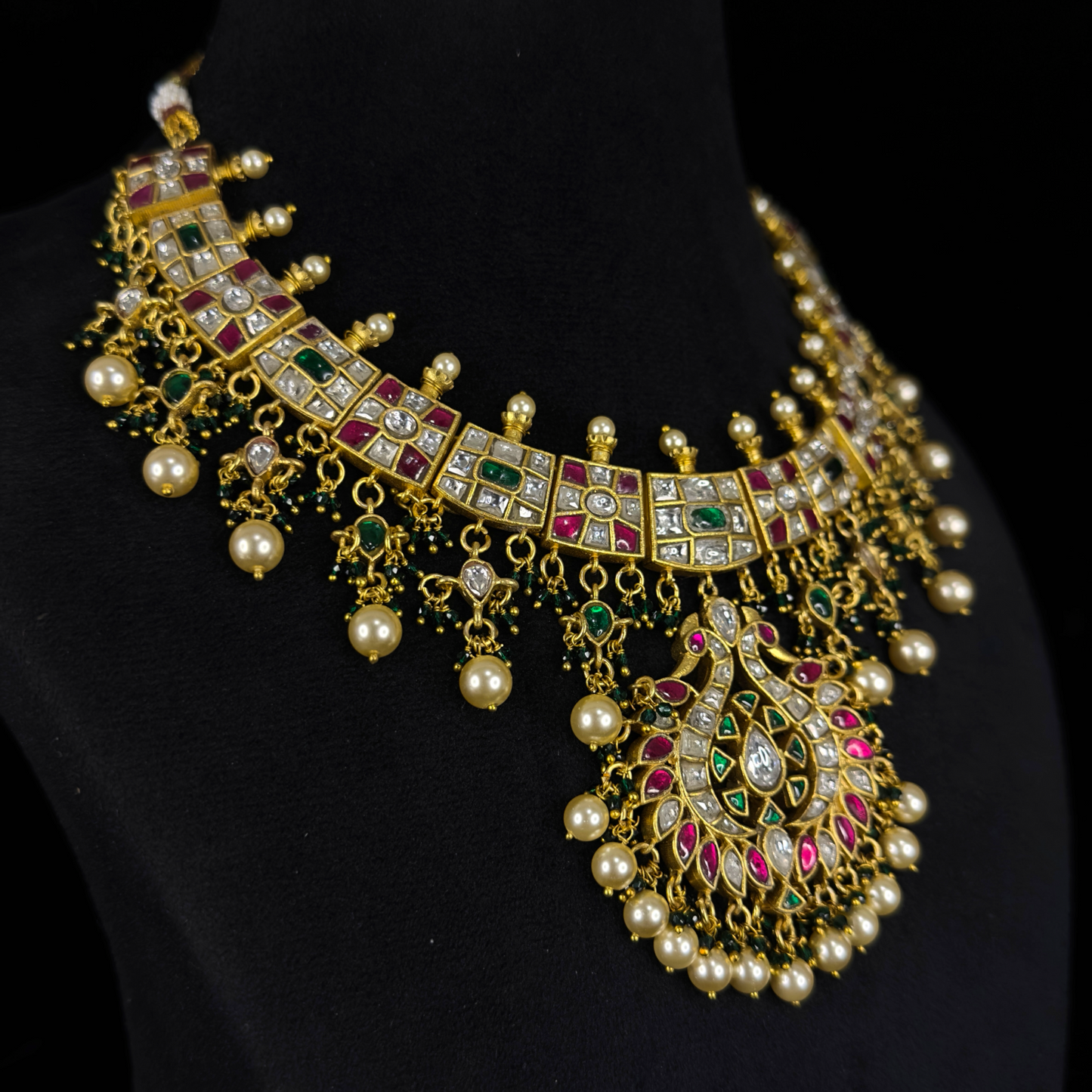 Opulent Jadau Kundan Necklace with Pearl and Green Accents with 22k gold plating This product belongs to Jadau Kundan jewellery Category