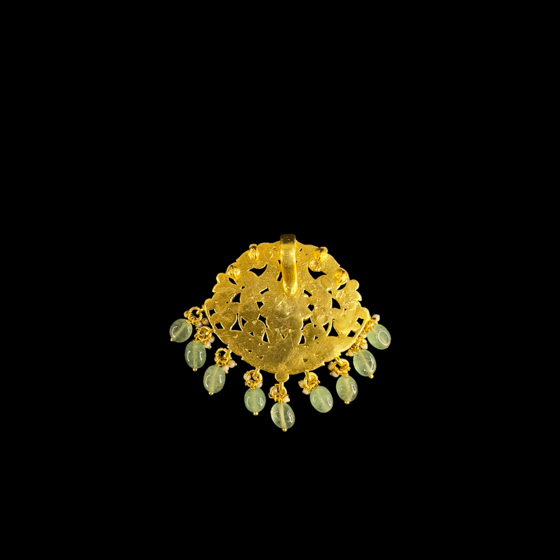 This is a Regal Jadau Kundan Pendant with Peacock motifs . The pendant is plated with 22k gold and at the bottom of the pendant we have Russian strawberry beads