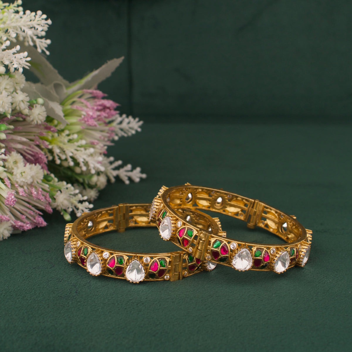 Close-up detailing of Elegant Victorian Polki Bangles With Ruby And Emerald Leaf Design