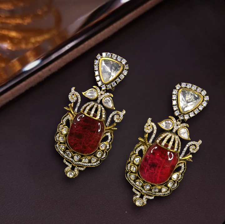 Antique-Victorian finish Kundan Earrings. This Victorian Jewellery is available in Red,Green & Pink colour variants. 