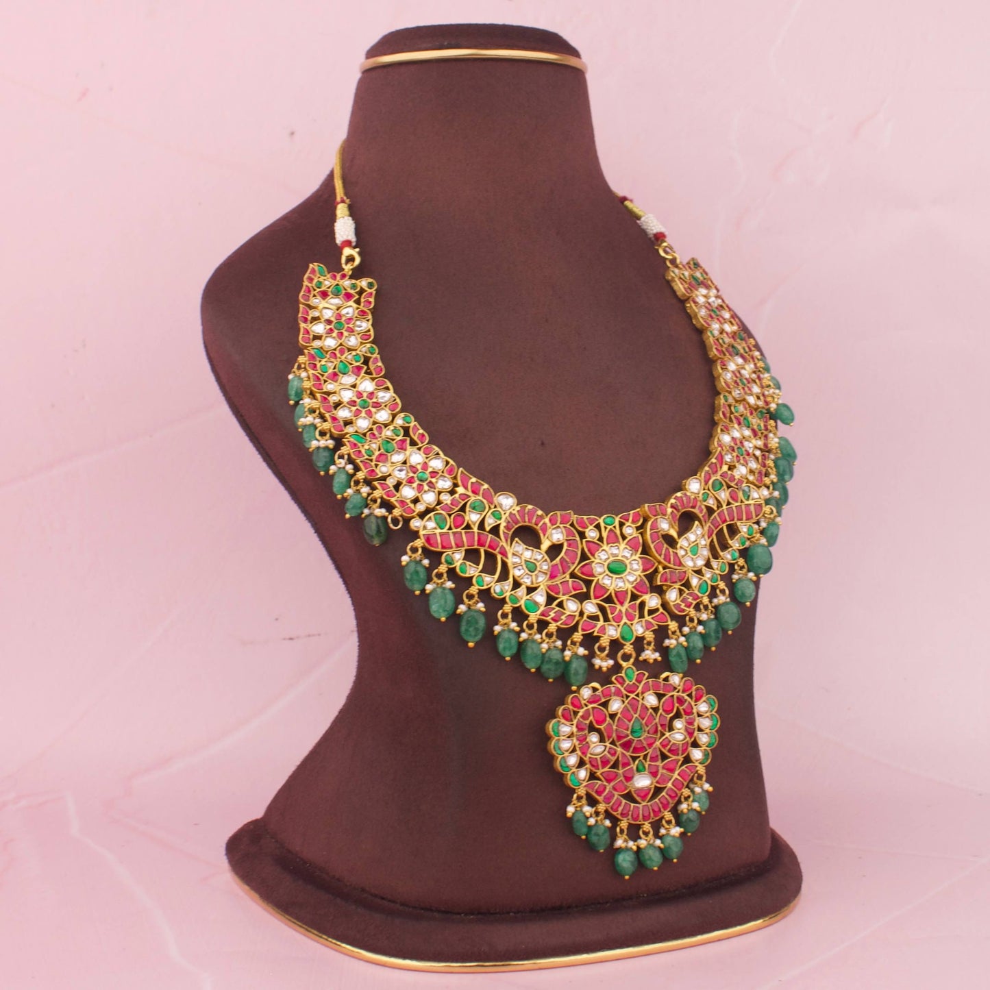 Premium Jadau Kundan Necklace With Ruby Stone Detailing, Emerald Bead Hanging And Floral Peacock Design With Pendant