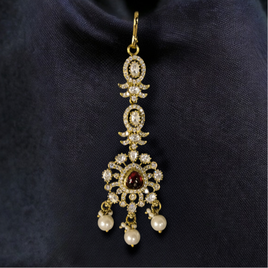 Minimalistic Victorian Maang Tikka with Freshwater pearl drops. This Victorian Jewellery is available in a Red colour variant. 