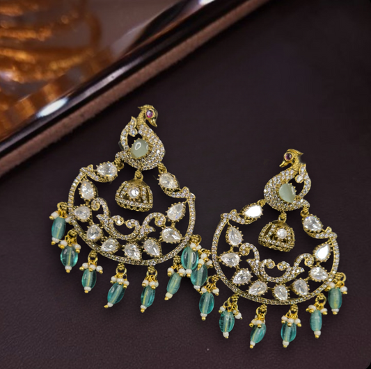 Victorian Zircon Chandbali with peacock motifs. This Victorian Jewellery is available in a Mint colour variant. 