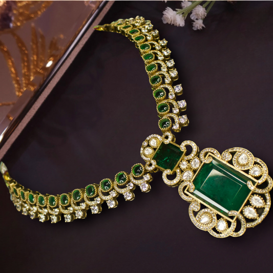 Nita Ambani Inspired Short Victorian Necklace set with zircon, moissanite polki, and emerald stones, including matching earrings. This Victorian Jewellery is available in a Red colour variant. 
