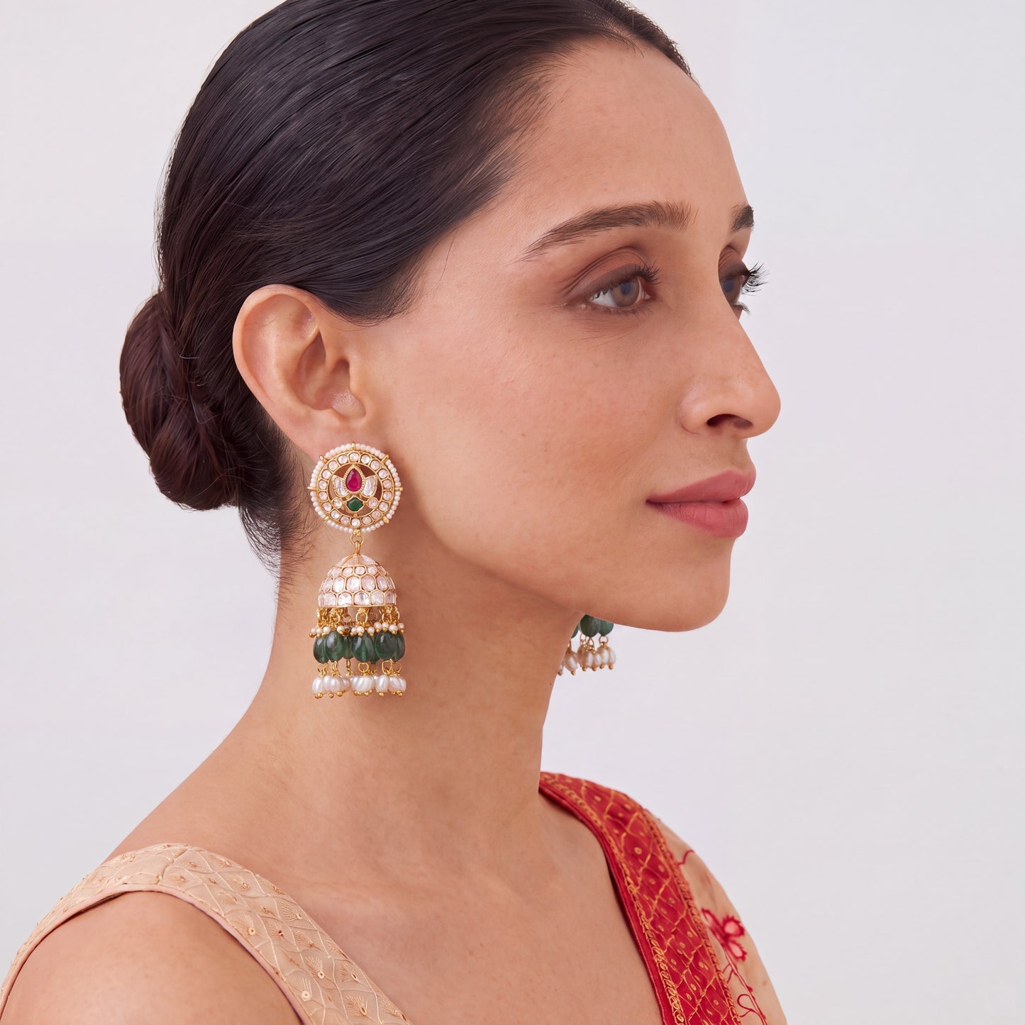 White Polki Kundan Jhumka Earrings With Green Beads
