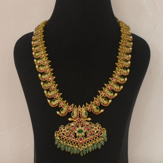 Traditional Long Jadau Kundan Mango Haram for Bridal Wear this piece is covered in 22k gold plating. This piece belongs in jadau Kundan jewellery category