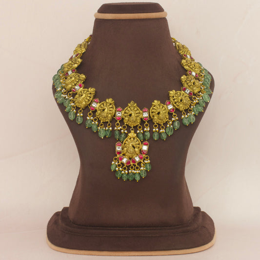 Peacock Splendor: Jadau Kundan Necklace with Green Bead with 22k Gold plating . This piece comes under Jadau Kundan jewellery 