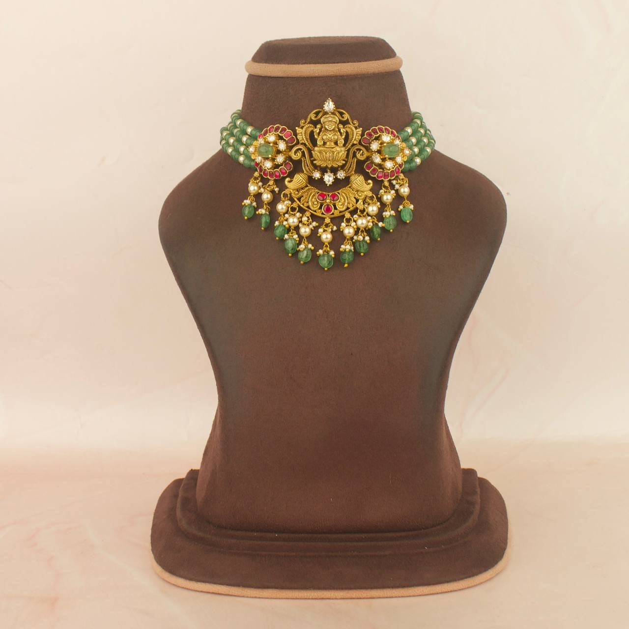 Divine Laxmi Devi choker with green beaded jadau kundan nakshi design