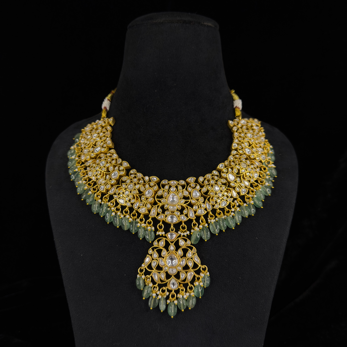 Exquisite Jadau Kundan Bridal Necklace Set with Emerald Bead Drops with 22k Gold plating This product belongs to Jadau Kundan jewellery category 
