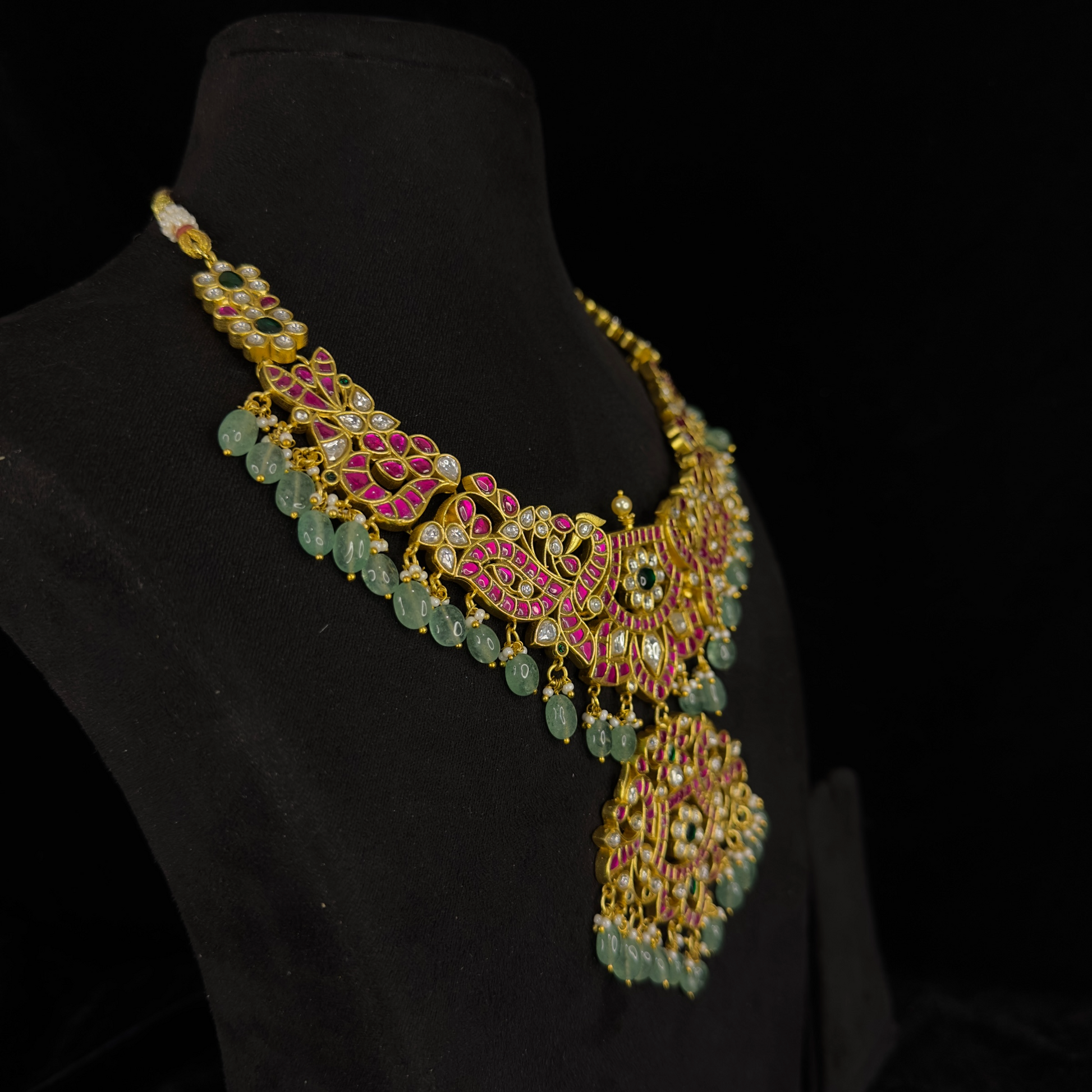 Regal Elegance Jadau Kundan Necklace with Green Bead Accents with 22k gold plating This product belongs in jadau kundan jewellery category
