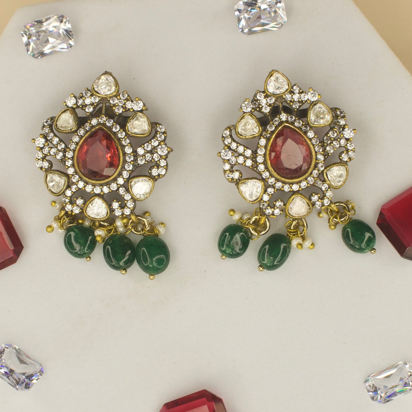 Polki studded Victorian plated studs with high quality victorian finish. available in ruby and green