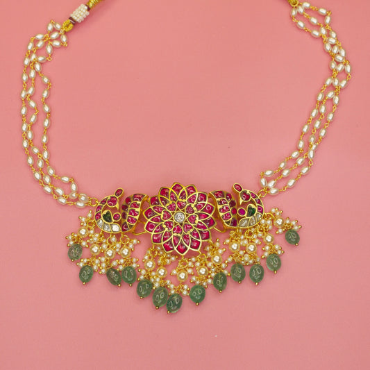 Handcrafted Peacock Jadau Choker with Kundan stones set in silver foil! The jewelry is embossed with rice pearls and beads! Timeless and classy traditional masterpiece!