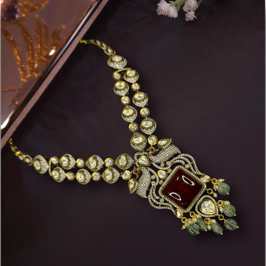 Two-Line Antique-gold Victorian Necklace set with Russian beads, zircon, moissanite polki stones, peacock motif, & pearls,including matching earrings. This Victorian Jewellery is available in Red,Green & Purple colour variants. 