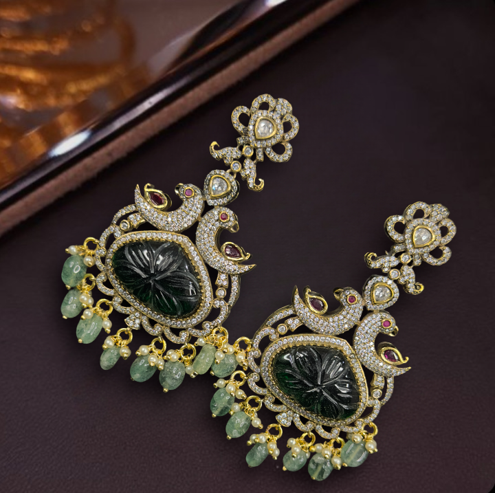 Diamond look Victorian Peacock Chandbali earrings. This Victorian Jewellery Is available in Red & Green colour varaiants. 