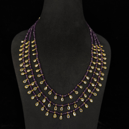Elegant Victorian Necklace in multi layer fashion. This antique jewellery is studded with high quality uncut stones. This Victorian Jewellery is available in Red,Green & Purple colour variants. 