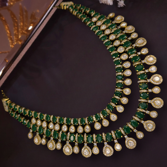 Gorgeous Two-Step Victorian Necklace with zircon, and moissanite polki stones, including matching earrings. This Victorian Jewellery is available in Red,Green & Purple colour variants. 