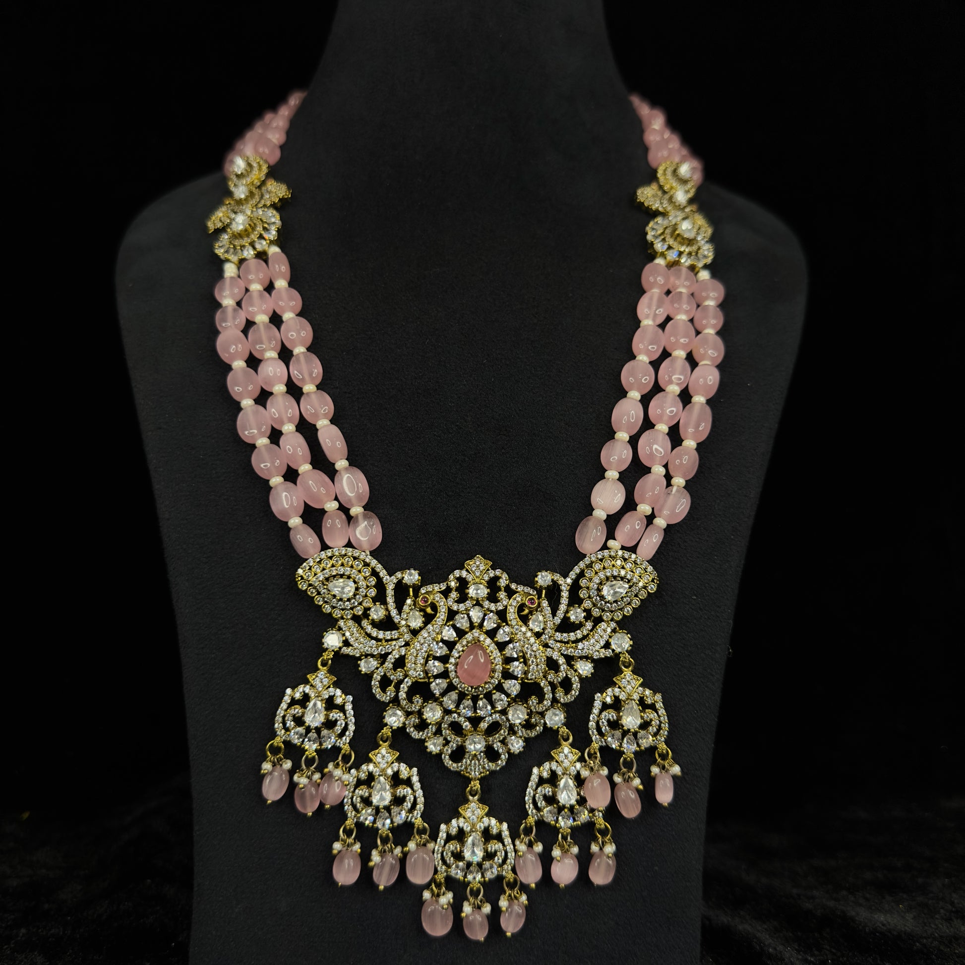 Handcrafted Zircon Beads Mala set in Victorian gold finish. This Victorian Jewellery Is available in Red & Pink colour varaiants.