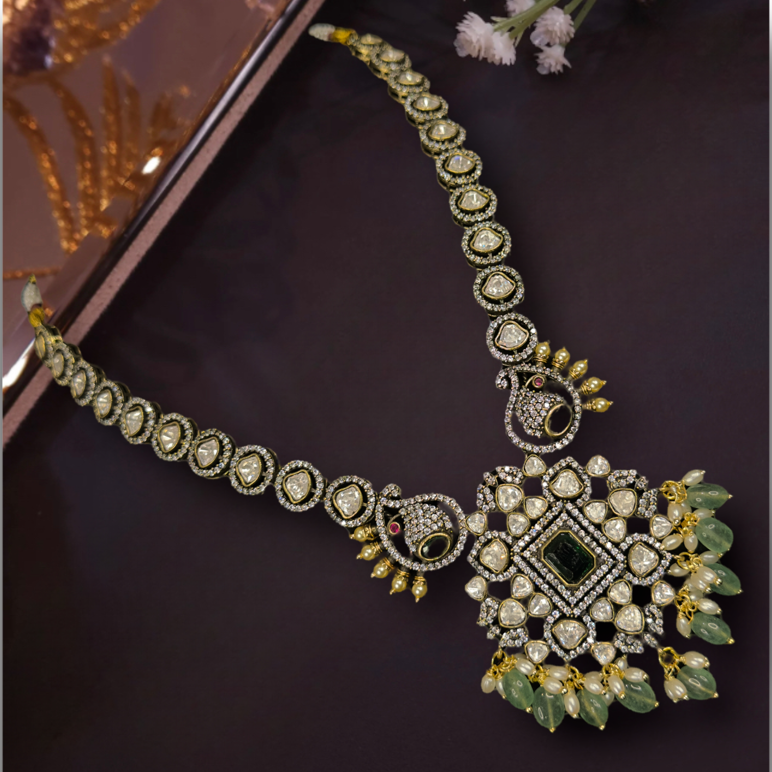Beautiful Victorian Necklace Set with zircon,moissanite polki stones,pearls, and beads,including matching earrings.This Victorian Jewellery is available in Red & Green  colour variants. 