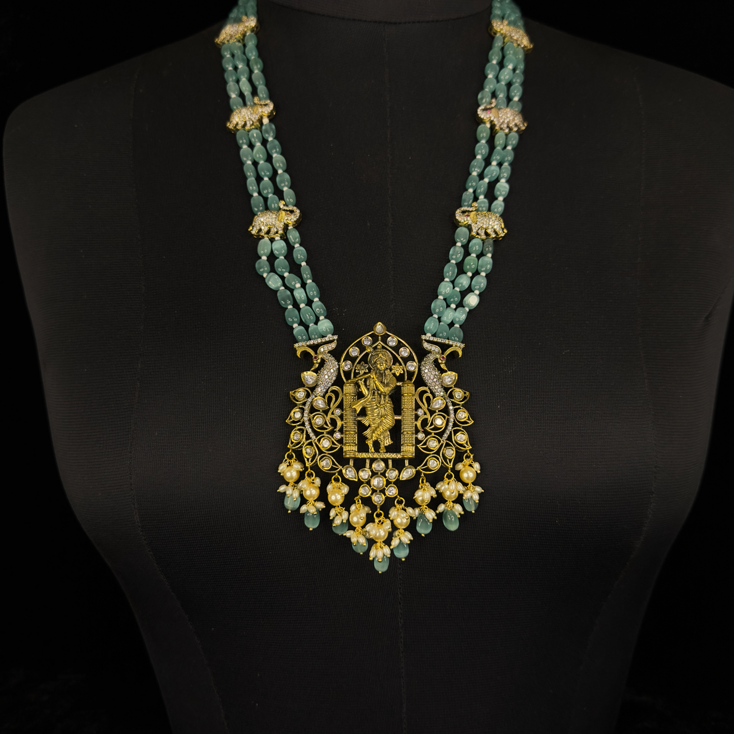 Lord Krishna Antique Pendant Set with Pearl drops. This Victorian Jewellery is available in a Mint colour variant. 