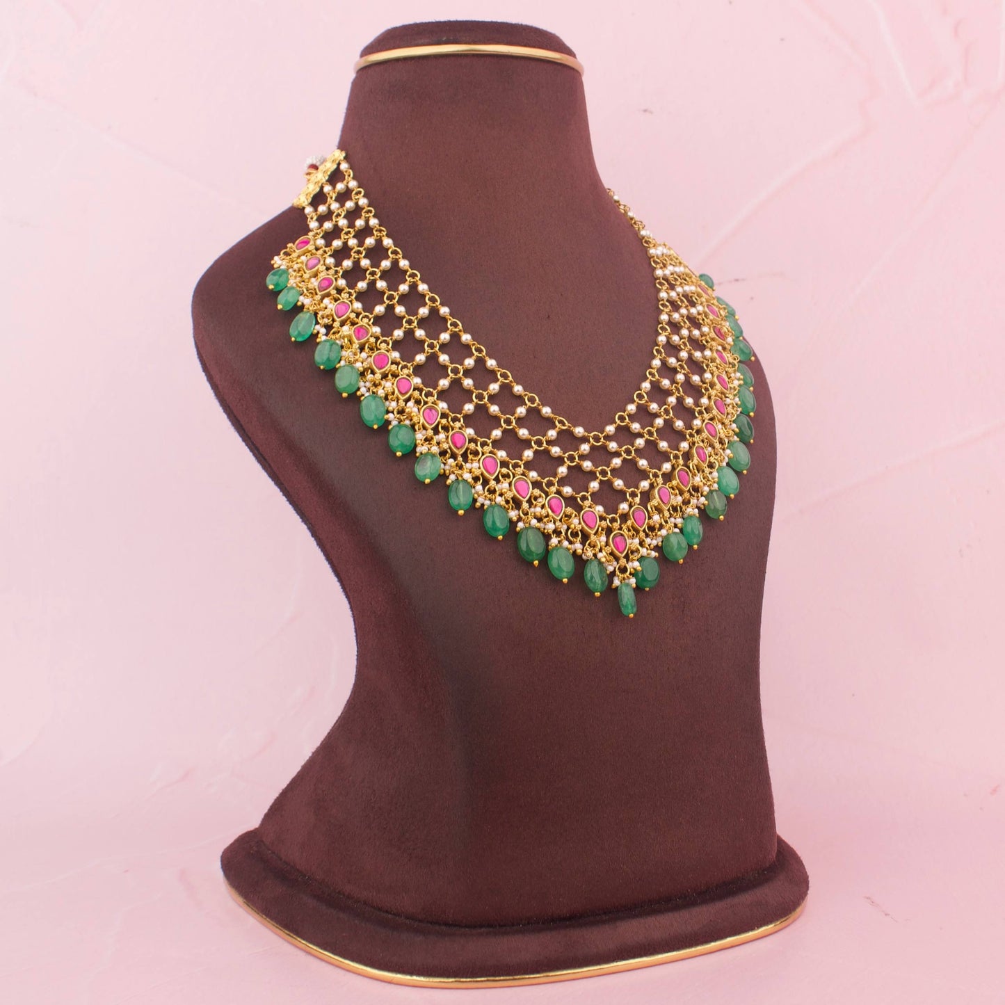 Gold Finish Jadau Kundan Necklace With Pearl Detailing And Emerald Green Hangings