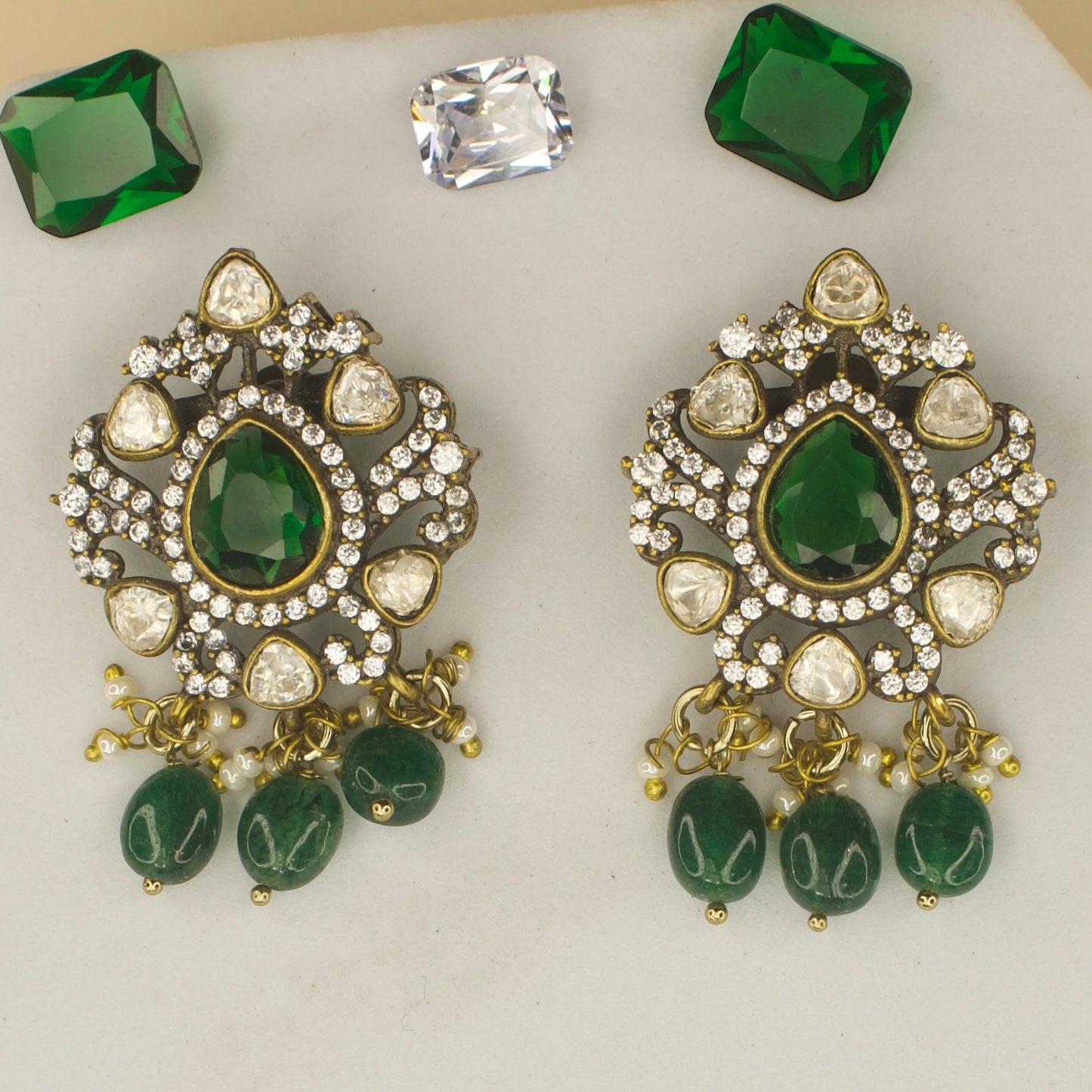 Polki studded Victorian plated studs with high quality victorian finish. available in ruby and green