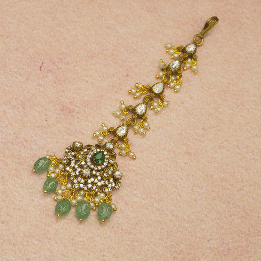 Opulent Victorian Maangtika with Polki, CZ, and Emerald Beads with high quality Victorian finish. This belongs to Victorian jewellery category