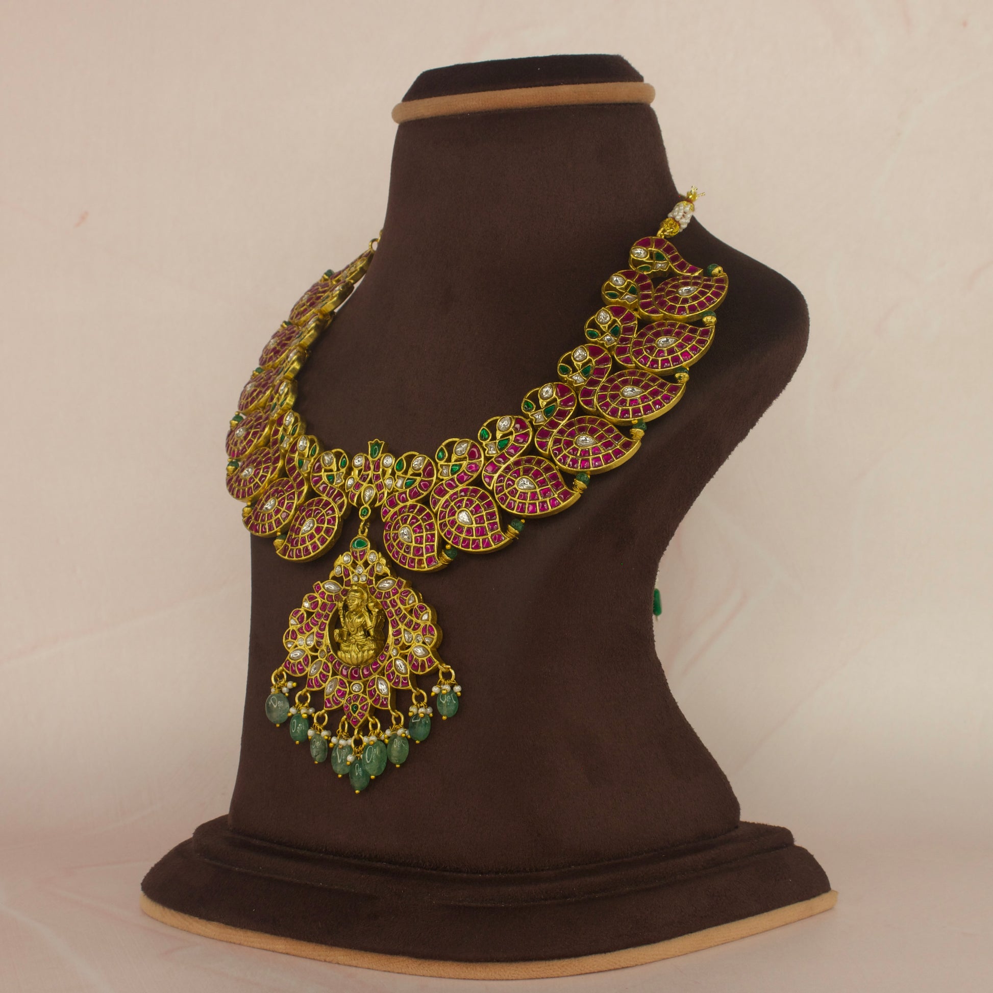 Exquisite Mango Motif Jadau Kundan Necklace with Temple Pendant with 22k gold platingThis product belongs to Jadau Kundan jewellery category