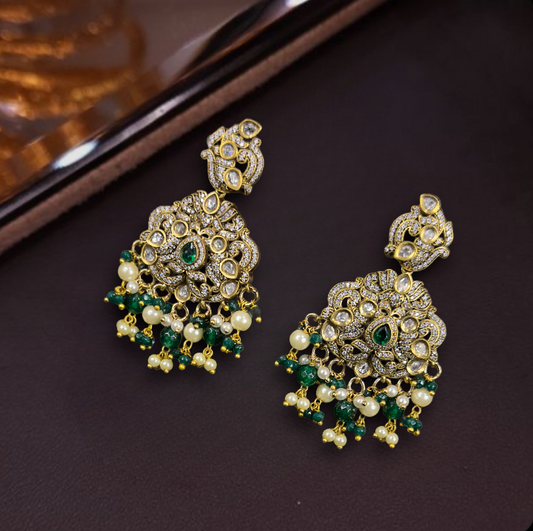 Victorian Kundan Polki Chandbali Earrings with rice pearls. This Victorian Jewellery is available in a Green colour variant. 