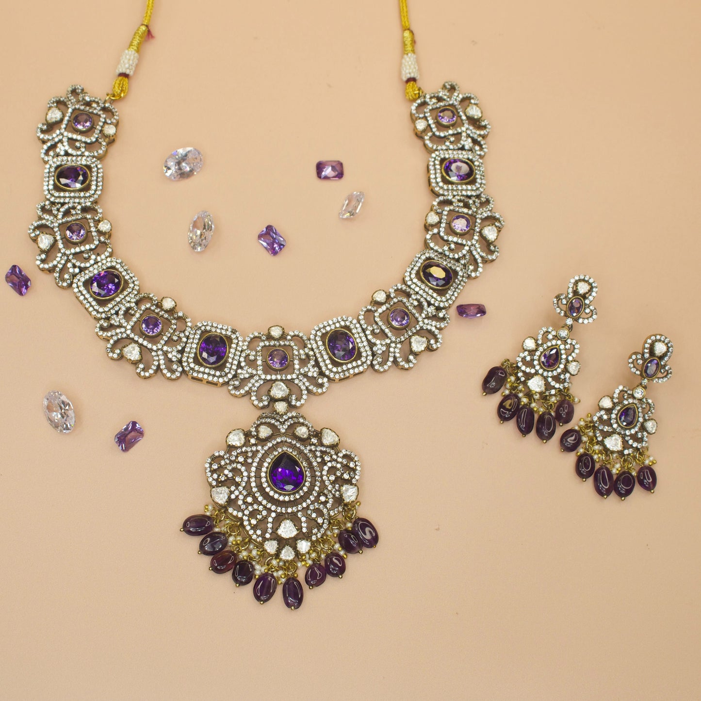 Robust Victorian Necklace Set with zircon, polki, pearls, and beads, including matching earrings. This Victorian Jewellery is available in Red & Purple colour variants. 
