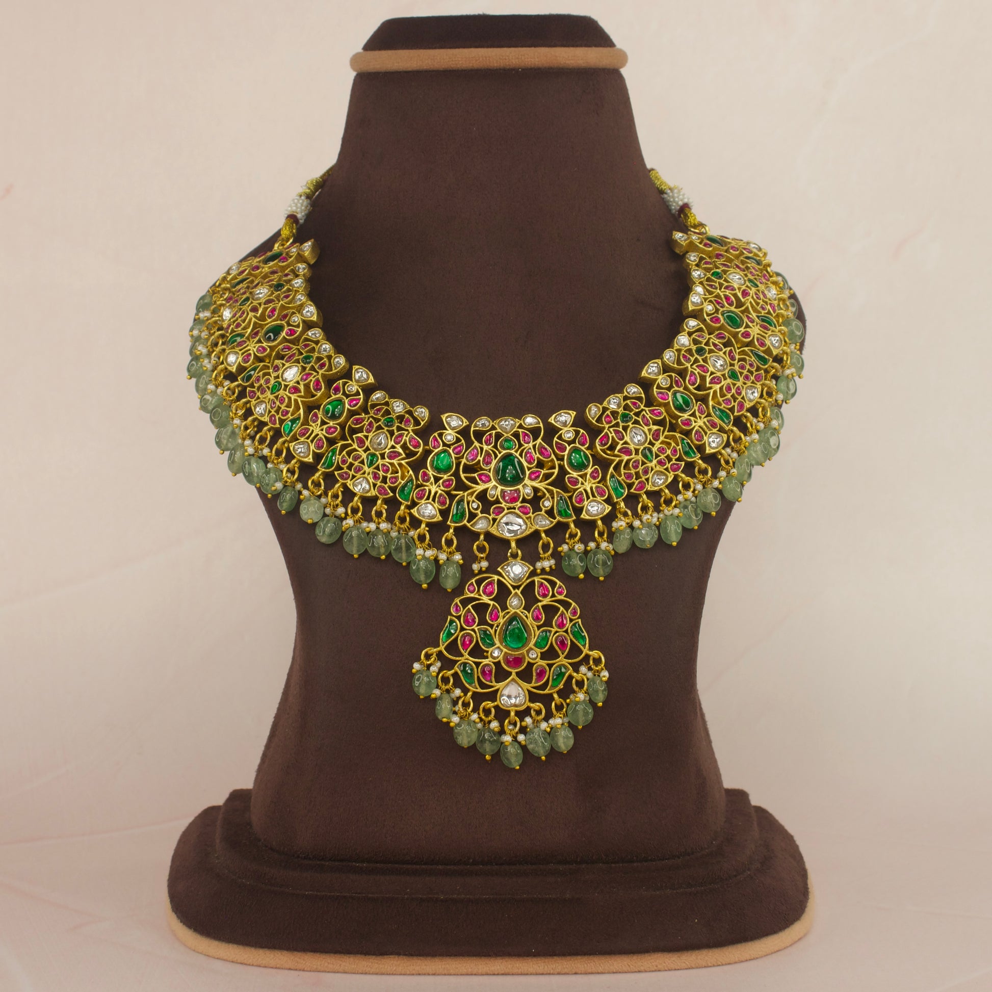 Majestic Jadau Kundan Necklace with Vibrant Green Drops with 22k gold plating This product belongs in jadau kundan jewellery category