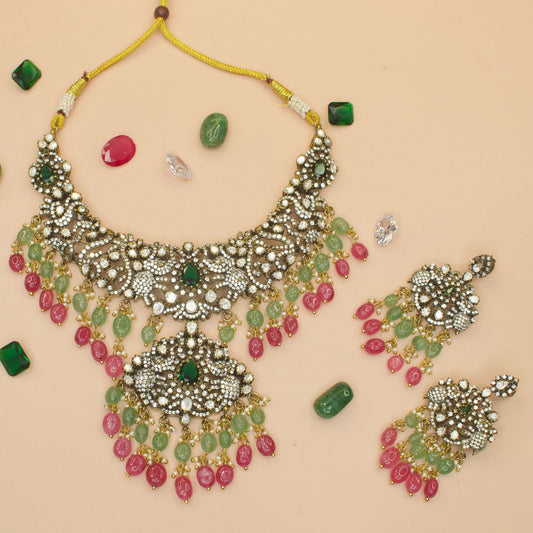 Peacock Victorian Polki Necklace with elephant motifs and earrings. This Victorian Jewellery is available in Red, Green, Mint & Purple colour variants. 