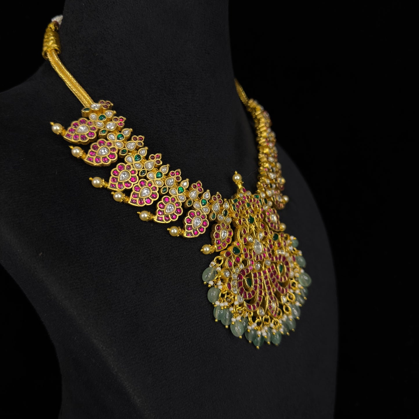 Elegant Jadau Kundan Mango Necklace with Peacock motifs pendant with 22k gold plating. This product belongs to jadau kundan jewellery category