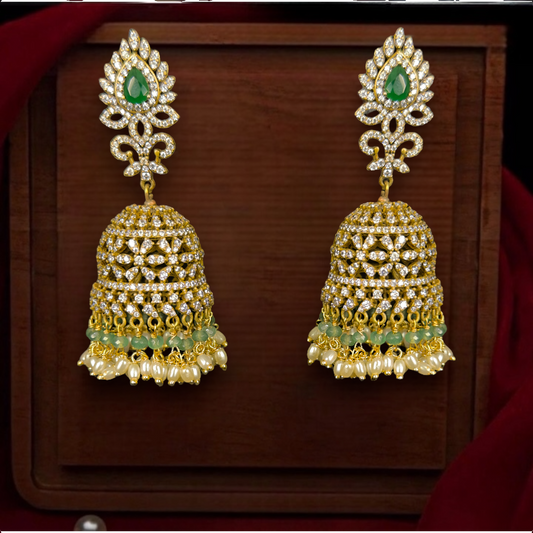 Radiant Victorian Zircon Jhumka with rice pearls. This Victorian Jewellery Is available in White & Green colour varaiants. 