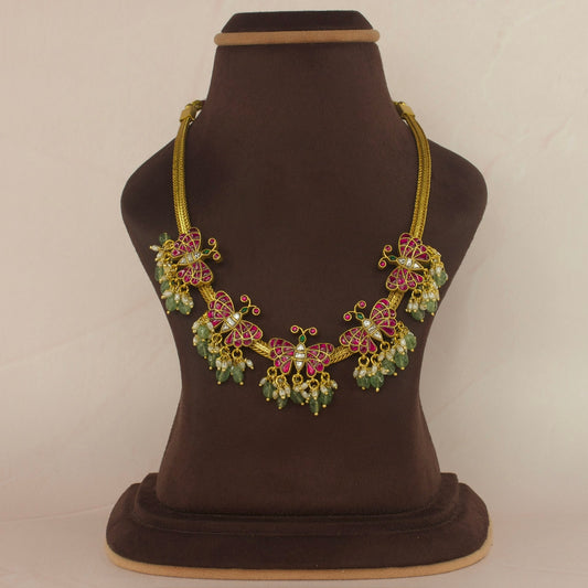 Floral Butterfly Jadau Kundan Short Necklace with Green Beads with 22k gold plating. This product belongs to jadau Kundan jewellery category