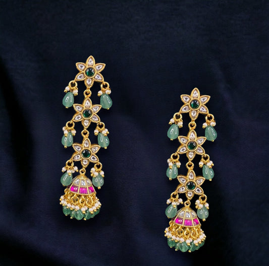 Cascading Floral Elegance Jadau Kundan Jhumkas with 22k gold plating. This product belongs to jadau kundan jewellery category