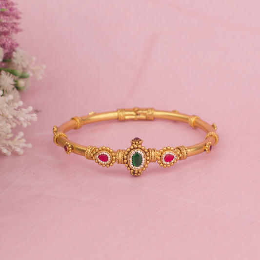 Traditional Temple Style Gold Bracelet With Emerald Centerpiece