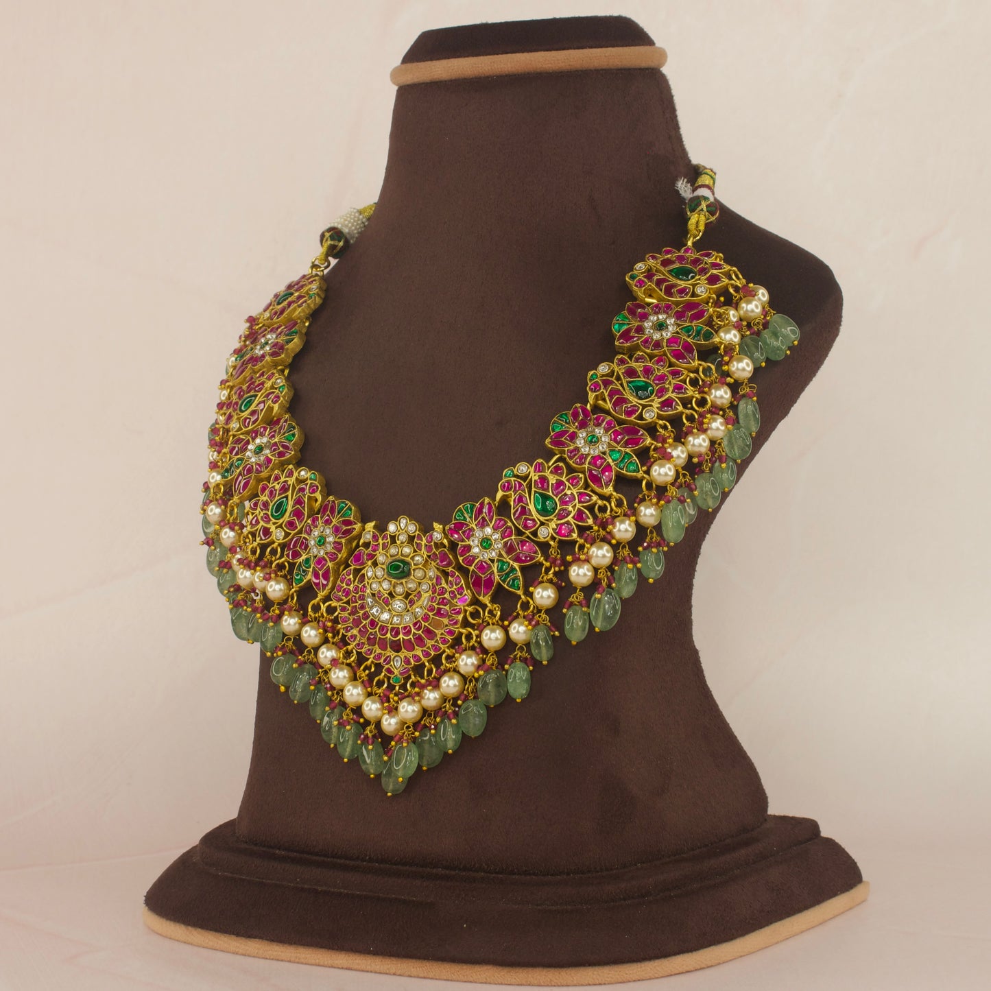 Majestic Jadau Kundan Necklace with Floral Motifs and Bead Drops with 22k gold plating This product belongs to Jadau Kundan jewellery category 