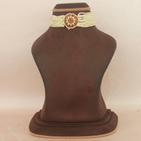 Sleek jadau kundan pearl choker with floral center locket