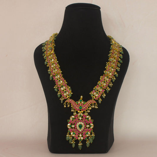 Exquisite Jadau Kundan Long Necklace with Russian Emeralds with 22k gold plating . This product belongs to Jadau Kundan jewellery collection